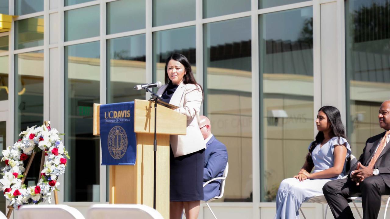 Xóchitl Rodriguez Murillo speaks on stage at event.