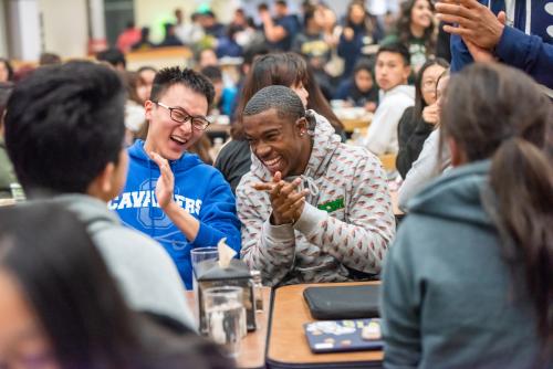 Two students photographed in the Tercero dining commons, during a mealtime.