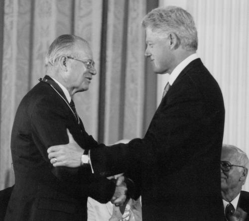 Cruz Reynoso and President Clinto shake hands at medal ceremony.