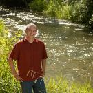 Photo: Andrew Fulks along Putah Creek in the UC Davis Putah Creek Riparian reserve