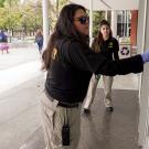 Student employees of the police department check to see if doors are locked.