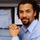 Photo: man's portrait with computer