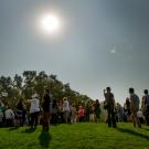 A crowd watches the eclipse.