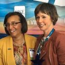 Dean Helene Dillard and Pam Pacelli, standing in front of themed backdrop.