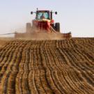 Machine discing soil