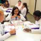 Young girls with computer-learning kits.