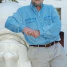 Photo: Charles Soderquist leaning against an Egghead sculpture