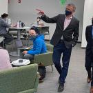 Law student Héctor Sánchez Castañeda walks through a study area with Dean Jean-Pierre Delplanque.