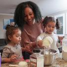 a mother and 2 daughters in the kitchen