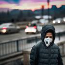 child on bridge over freeway traffic 