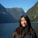 Student pictured in front of a picturesque New Zealand landscape