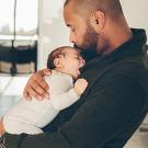 Man holding a baby.