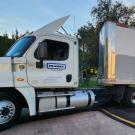 Tractor part of tractor-trailer rig, stuck on traffic circle