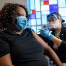 Woman receives vaccine in church.