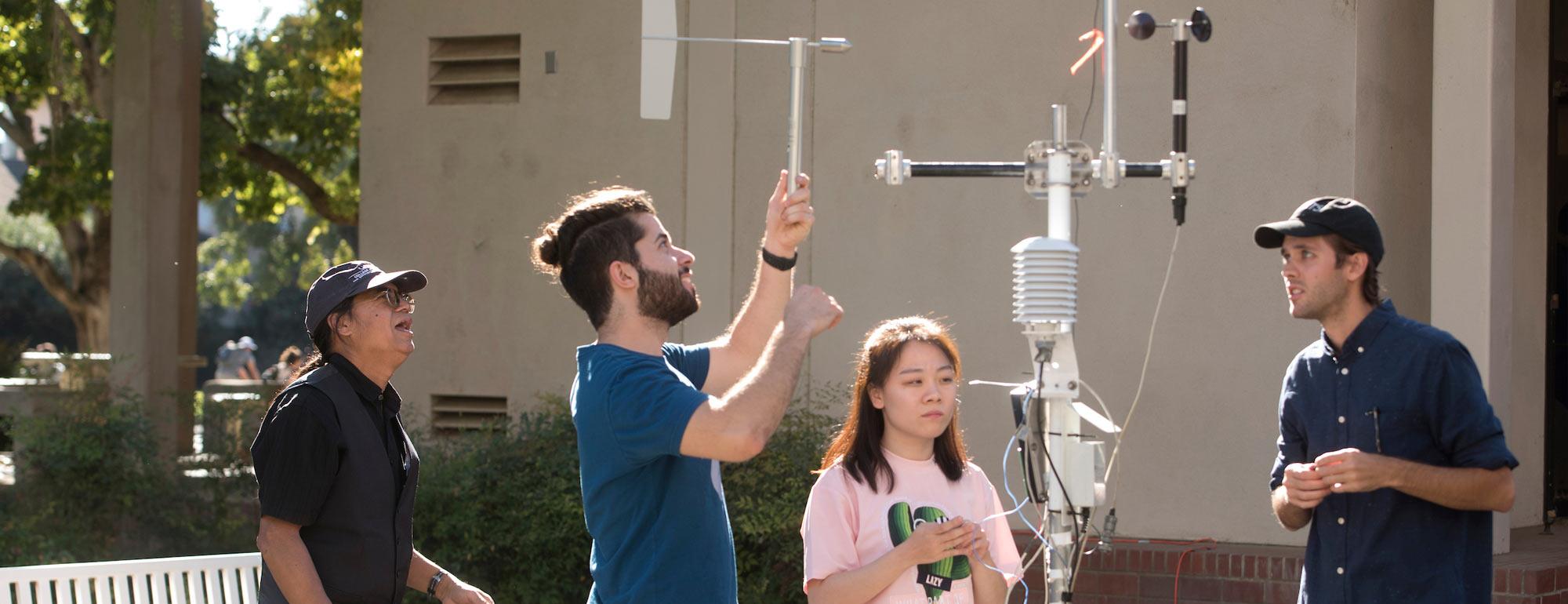 Students working with weather instruments