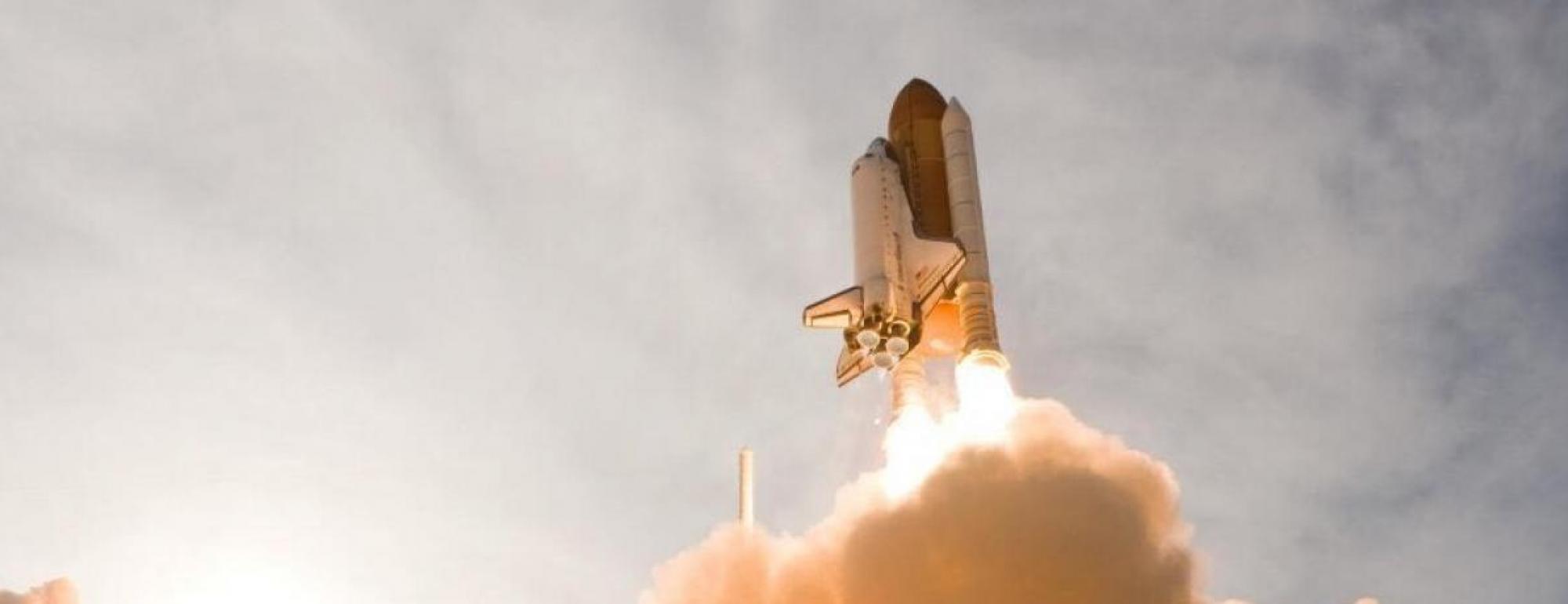 rocket launching into sky