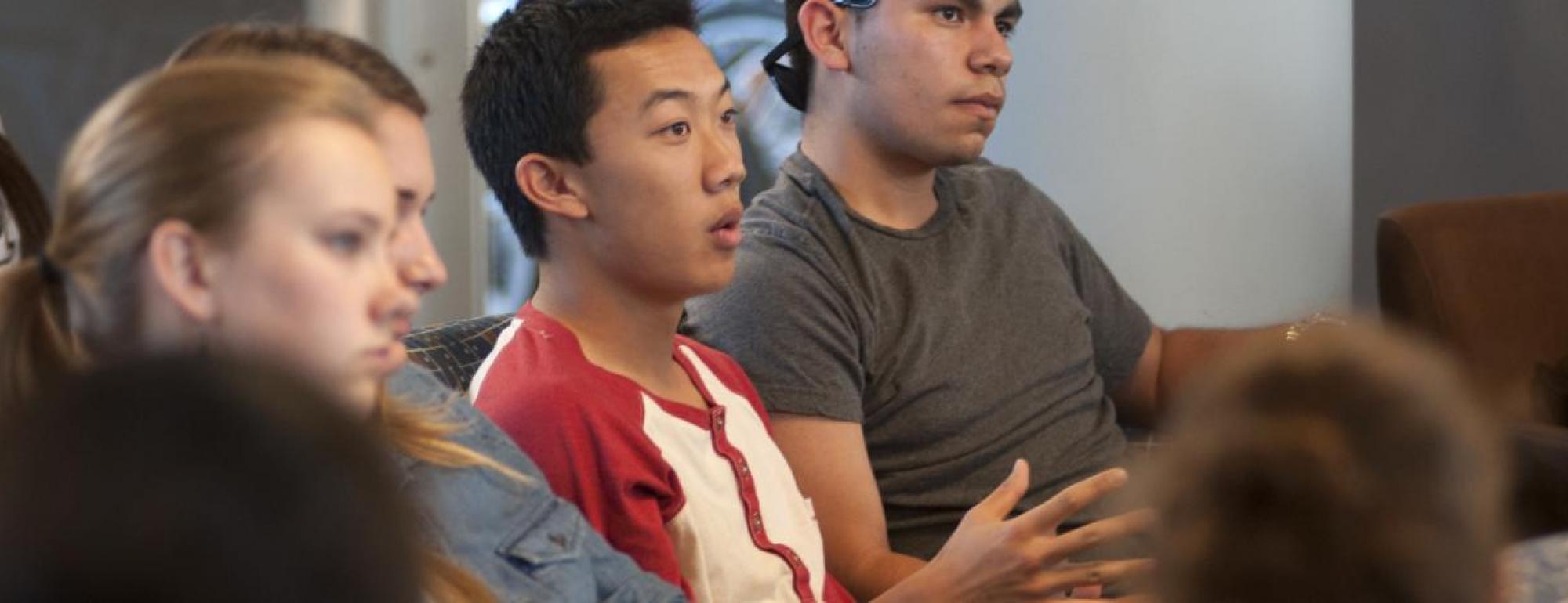 uc davis student answers a question in lecture as other students watch