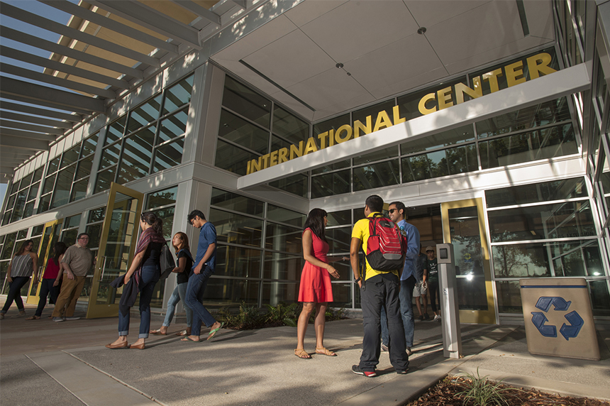 People standing in front of the International Center