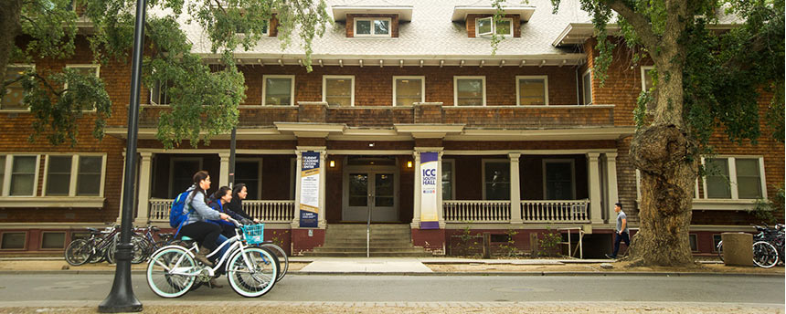 UC Davis' South Hall with bicyclists riding past